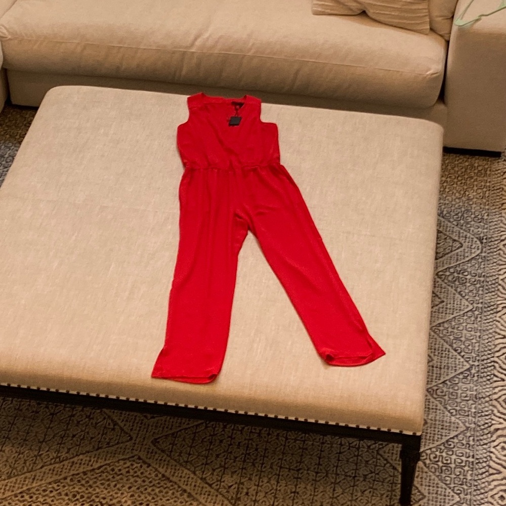 Bright red bcbg max azria jumpsuit with pockets.